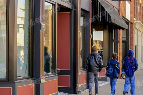Preview: Three Male Teenagers Walking In The Street Talking; View From The Back
