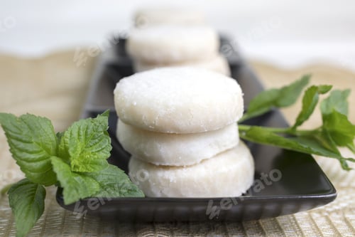 Preview: Lemon And Vanilla Shortbread Cookies Stacked On A Black Ceramic Dish On A Lace Doily And Garnished