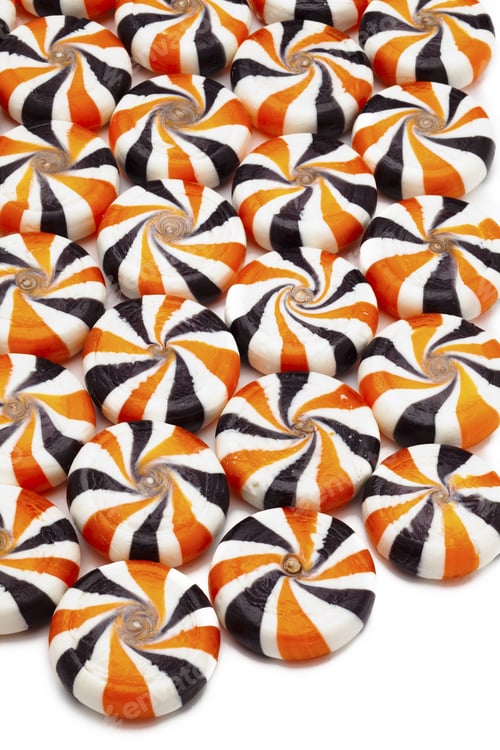 Preview: Close-Up Shot Of Colorful Hard Candies Arranged Over Plain White Background.