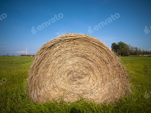 Preview: Hay Bale In Field With Sky In The Background.