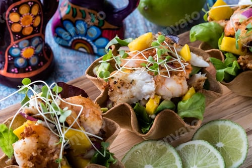 Preview: Close Up View Of Fish Tacos Of Sole And Prawns Covered With A Mango Avocado Salsa.