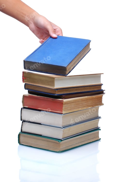 Preview: Student Selecting Book From Stack Of Old Text Books Isolated Over White Back To School Concept.