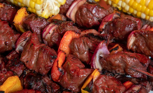 Preview: Close Up Of Beef Tenderloin Skewers Or Shish Kebabs With Red And Yellow Peppers And Onion Pieces