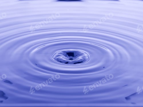 Preview: Close Up Water Droplet Affect The Surface, Forming Rings On The Surface And Making A Perfect