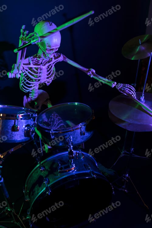 Preview: High View Bony Man Lit By Purple Light With Green Highlights Drumming