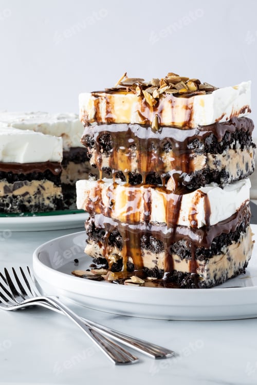 Preview: A Straight On View Of Two Slices Of Chocolate And Mocha Flavoured Ice Cream Pie Stacked On Top Of