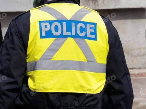 Preview: A Reflective Yellow Police Officer'S Safety Vest