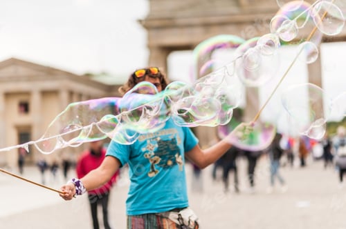 Preview: Street Performer, Busker, Entertaining The Crowd In Front Of The Brandenburg Gate In Berlin On An