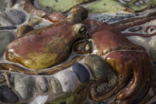 Preview: Beautiful Octopus Embedded In A Planter'S Edge At A Park