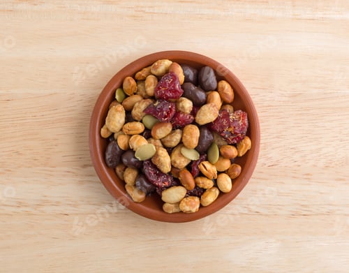 Preview: Top View Of A Portion Of Trail Mix With Soy Beans, Dried Cranberries And Pumpkin Seeds Sprinkled