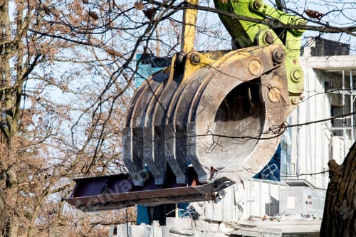 Preview: Demolition Machine Grappling Jaws Holding A Steel Beam