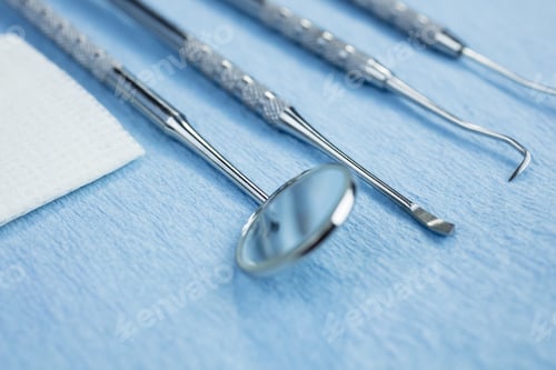 Preview: Dental Picks, Mirror And Gauze On A Paper Lined Tray