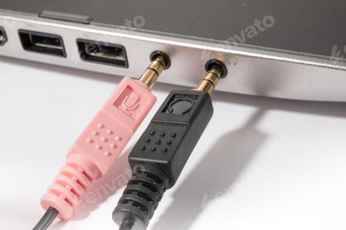 Preview: Macro Closeup Of A Microphone Plug Amd A Right Angle Headphone Plug And Sockets On Notebook Computer