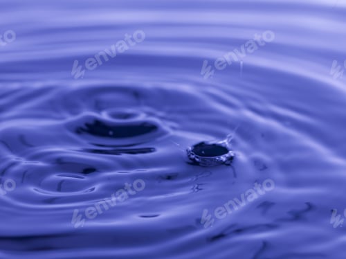 Preview: Water Drop Falling Into Blue Water Abstract Background