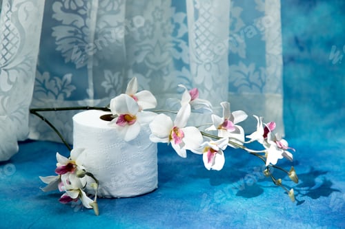 Preview: Rolls Of Toilet Paper With White Flowers On A Dramatic Soft Blue Background