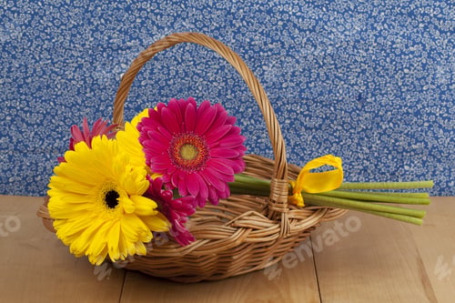 Preview: Daisy Flowers In Wicker Basket On Wooden Table