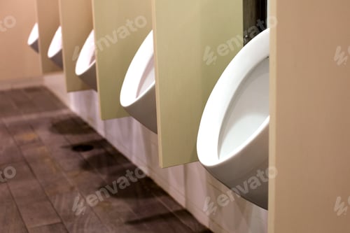 Preview: A Row Of Round White Modern Urinals In A Large Men'S Washroom