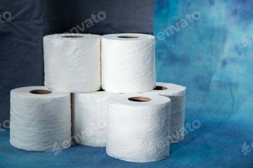 Preview: Rolls Of Toilet Paper On A Dramatic Soft Blue Background