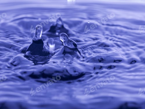 Preview: Water Drop Falling Into Blue Water Abstract Background