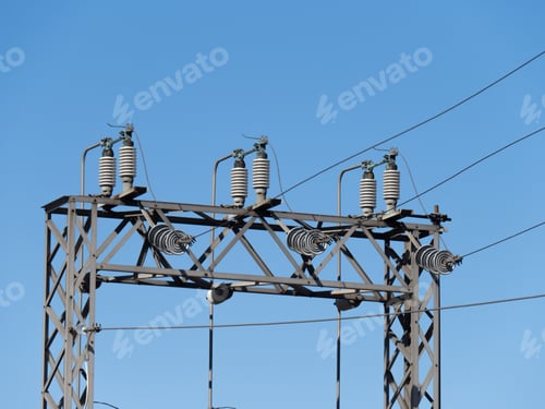 Preview: A High Voltage Electricity Distribution Structure With Ceramic Insulators On A Clear Blue Sky