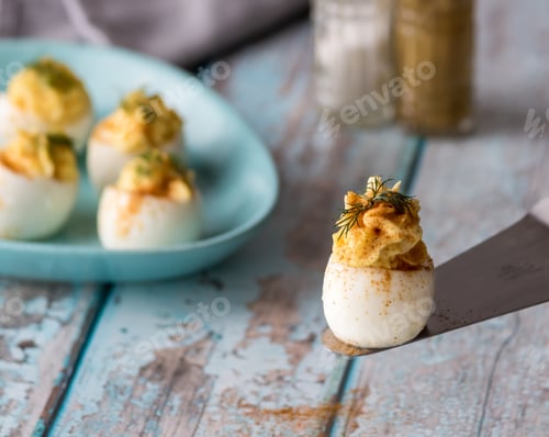 Preview: A Close Up Front View Of Deviled Eggs Ready For Snacking.