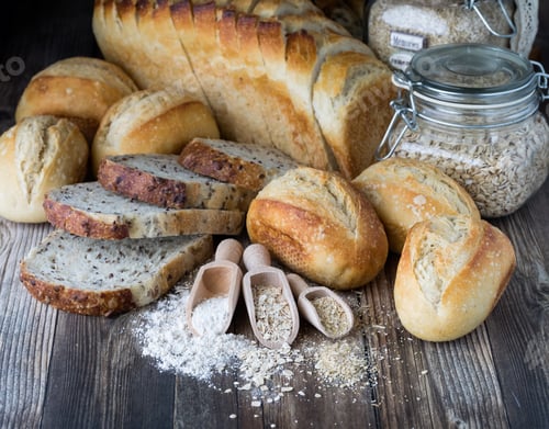 Preview: Assorted Breads With Ingredients In Front On A Wooden Table.
