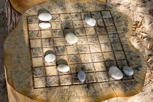 Preview: Overhead View Of A Wooden Chess Board On A Beach Made From A Tree Stump