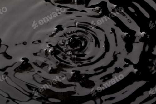 Preview: Close Up Water Droplet Affect The Surface, Forming Rings On The Surface And Making A Perfect