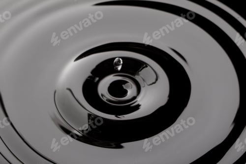 Preview: Close Up Water Droplet Affect The Surface, Forming Rings On The Surface And Making A Perfect
