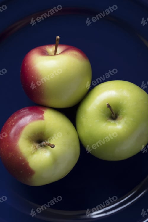 Preview: Three Green And Red Crab Apples On A Blue Plate As Still Life