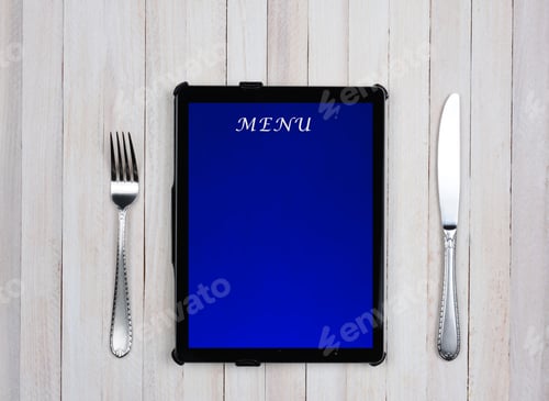 Preview: Tablet Computer With Menu On The Screen On A Rustic Wood Restaurant Table. Electronic Food Service