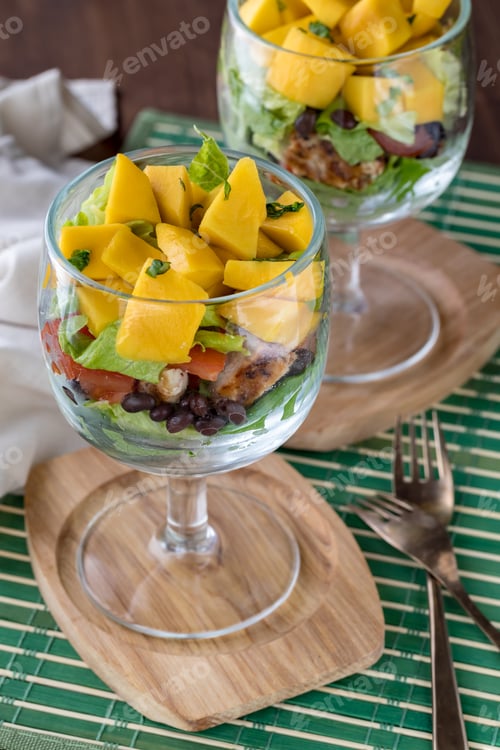 Preview: Top Down View Of Chalice Glasses Filled With A Layered Caribbean Salad.