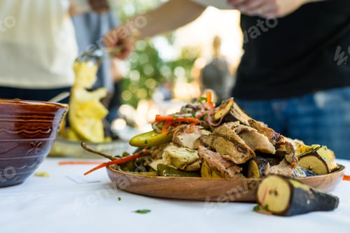 Preview: Succulent Juicy Chicken And Vegetables Sit On A White Plate On The Buffet Line Of A Dinner Party.