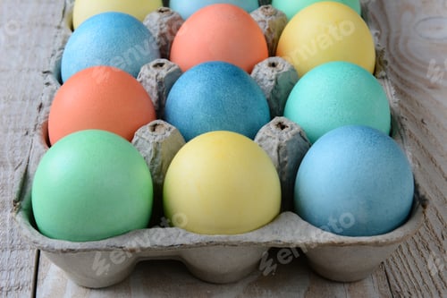 Preview: Closeup Of An Easter Egg Carton On A Rustic Kitchen Table. Horizontal Format.