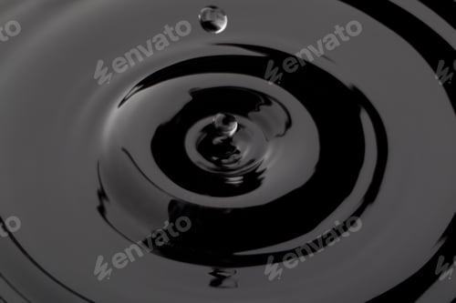 Preview: Close Up Water Droplet Affect The Surface, Forming Rings On The Surface And Making A Perfect