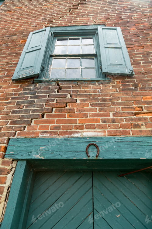 Preview: An Old Brick Warehouse With Deteriorating Walls, Windows, And Doors, But Still In Use.