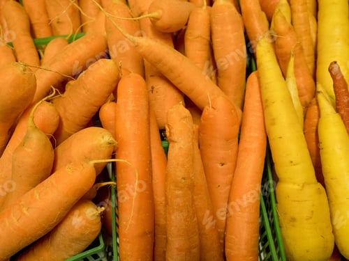 Preview: Boxes Of Orange And Yellow Carrots 0N A Market Vendor Table