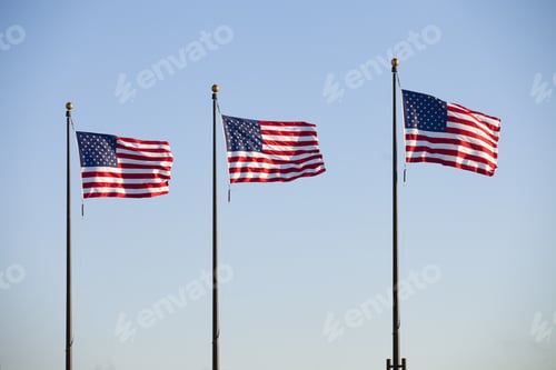 Preview: American Flags Waving In Blue Sky