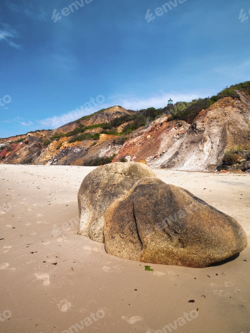 Preview: The Tip Of A Lighthouse Can Be Seen Above A Hill On A Beach In Martha'S Vineyard.