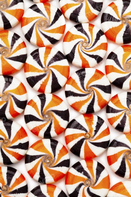 Preview: Close-Up Shot Of Colorful Hard Candies With Swirl Design Arranged Beside Each Other.