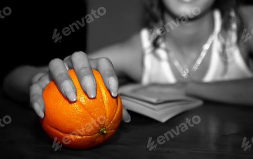 Preview: Girl'S Hand With An Orange
