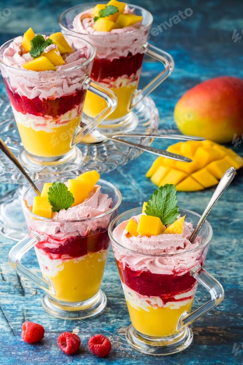Preview: Front Facing View Of Layered Dessert Glasses Filled With Layers Of Mango And Raspberry Mousse And