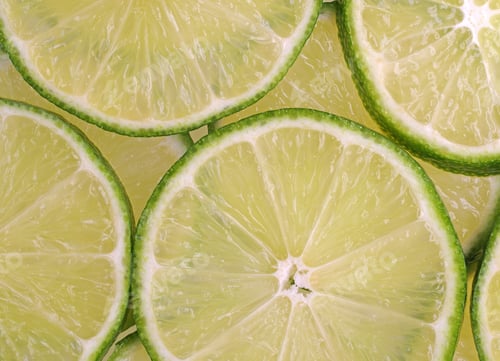 Preview: Close View Of Several Slices Of Lime Illuminated With Natural Light.