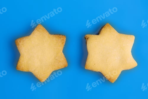 Preview: Star Of David Shaped Hanukkah Cookies On A Blue Background