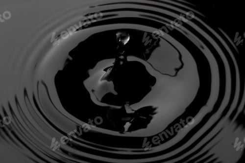 Preview: Close Up Water Droplet Affect The Surface, Forming Rings On The Surface And Making A Perfect