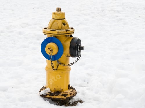Preview: A Yellow Rusty Fire Hydrant In The Snow In Winter