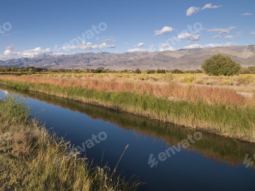 Preview: Blue Narrow River Below A Clear Sky