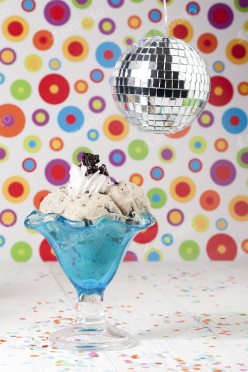 Aperçu: Image Of Cookies And Cream Ice Cream Glass With Crystal Ball Above And Colorful Background