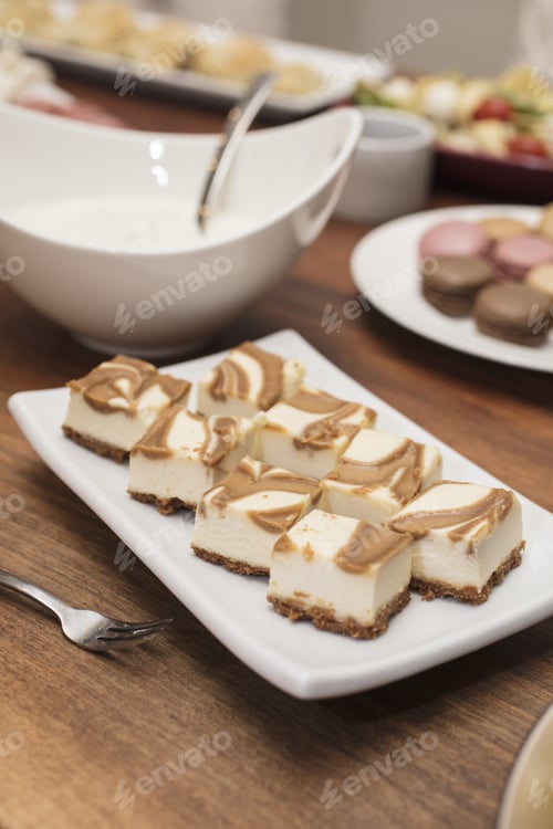 Preview: Vanilla Cheesecake Squares Swirled With Caramel, With Cold Cuts And Quiche Appetizers In The