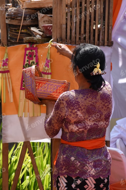 Preview: A Woman Performing A Traditional Balinese Offering
